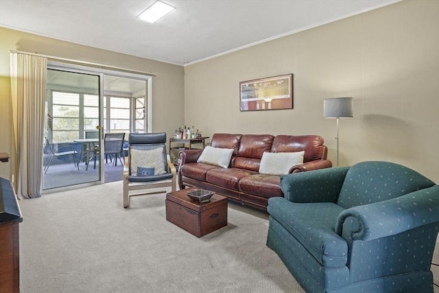 living room with ornamental molding and carpet flooring