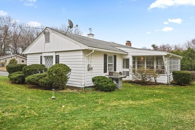 1 Dubiel Dr, Worcester, MA 01609 - rear view of property with a yard, a sunroom, and a chimney
