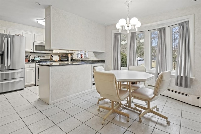 dining room with light tile patterned flooring and an inviting chandelier