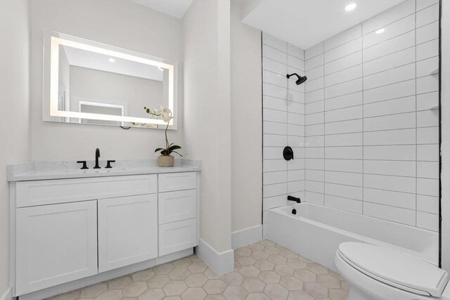 40 Maplewood Unit 40, Boston, MA 02132 - full bathroom with tub / shower combination, baseboards, toilet, vanity, and tile patterned flooring