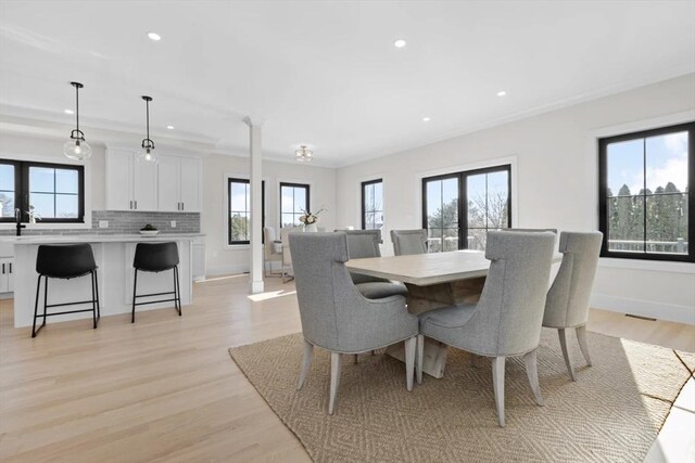 40 Maplewood Unit 40, Boston, MA 02132 - dining space with decorative columns, recessed lighting, baseboards, light wood-style floors, and ornamental molding