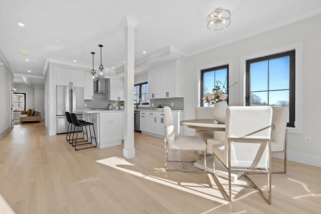 40 Maplewood Unit 40, Boston, MA 02132 - dining space with light wood-style flooring, crown molding, baseboards, and recessed lighting