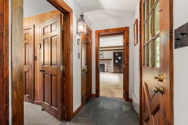 5 Villa Ln, Peabody, MA 01960 - corridor with dark carpet and stone tile flooring