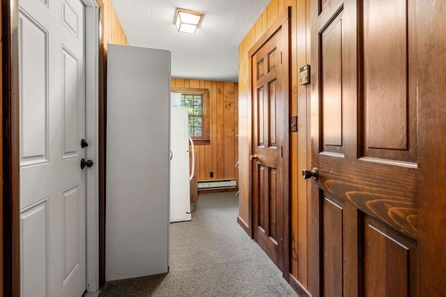 5 Villa Ln, Peabody, MA 01960 - hallway with a baseboard radiator, carpet floors, and a textured ceiling