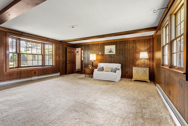 5 Villa Ln, Peabody, MA 01960 - sitting room featuring a baseboard heating unit, wood walls, beam ceiling, and carpet floors