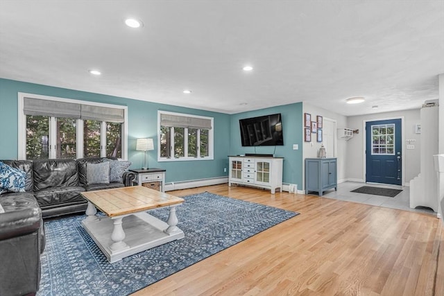 16 Vanderbelt Rd, Acton, MA 01720 - living area featuring a baseboard radiator, recessed lighting, baseboards, wood finished floors, and a wall mounted AC