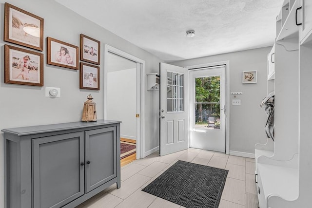 16 Vanderbelt Rd, Acton, MA 01720 - entryway featuring baseboards