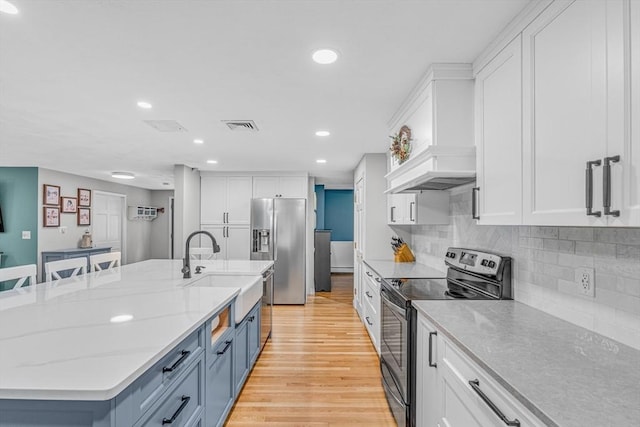 16 Vanderbelt Rd, Acton, MA 01720 - kitchen with appliances with stainless steel finishes, a sink, white cabinets, and recessed lighting