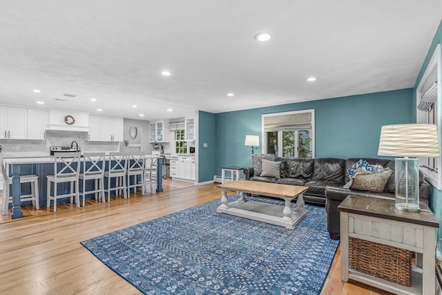 16 Vanderbelt Rd, Acton, MA 01720 - living area featuring recessed lighting, light wood-style flooring, and a baseboard radiator
