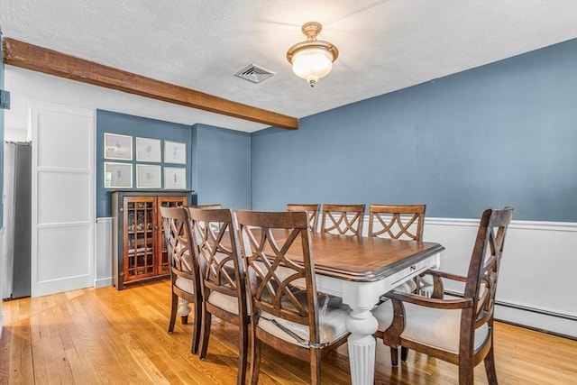 16 Vanderbelt Rd, Acton, MA 01720 - dining space with wood finished floors, a bar, and beamed ceiling