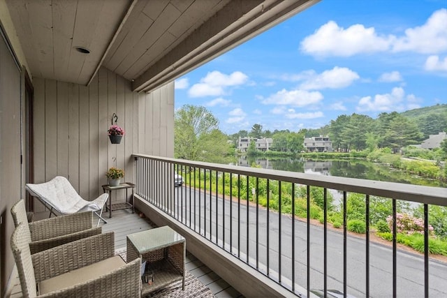 116 Mill Pond Unit 116, North Andover, MA 01845 - balcony with a water view and view of wooded area