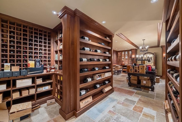 180 Ash St, Weston, MA 02493 - wine area featuring stone tile flooring, a chandelier, and recessed lighting