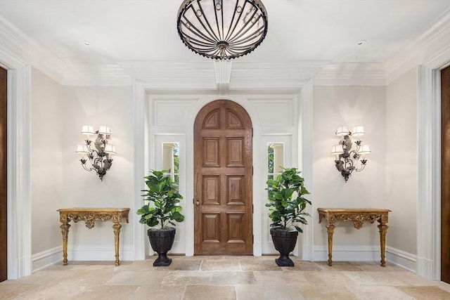 180 Ash St, Weston, MA 02493 - foyer entrance featuring stone tile floors, crown molding, and baseboards