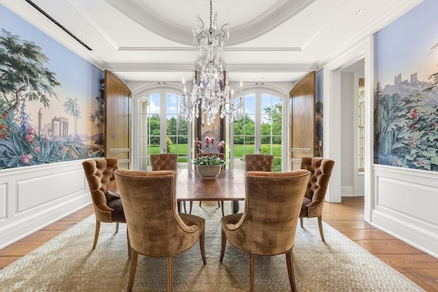 180 Ash St, Weston, MA 02493 - dining area with light wood finished floors, a chandelier, a decorative wall, french doors, and a raised ceiling