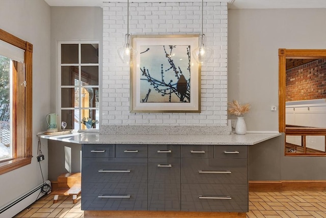 bar with tasteful backsplash, a baseboard radiator, and baseboards