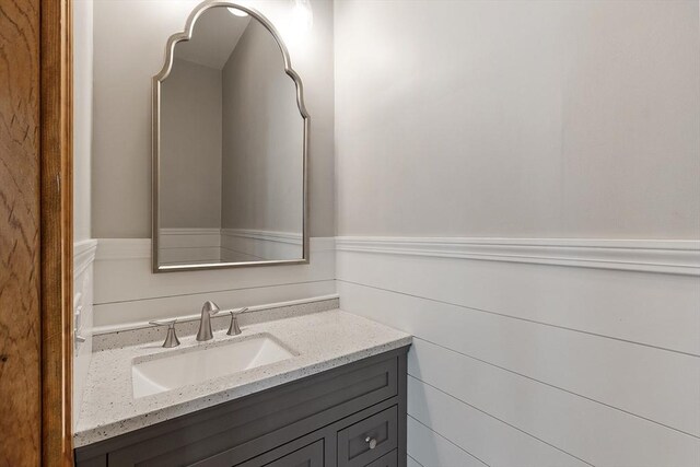 bathroom with wainscoting and vanity