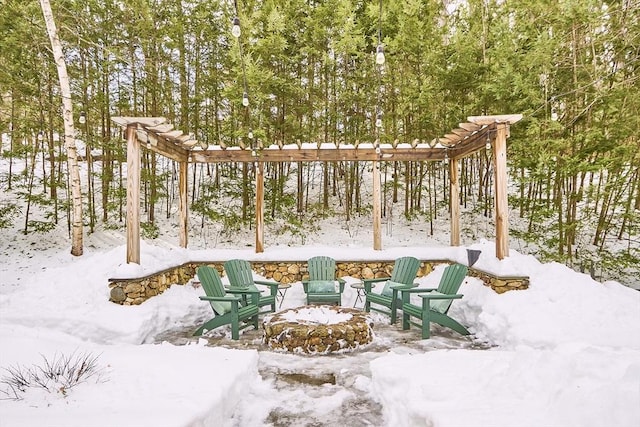 view of patio featuring a fire pit and a pergola