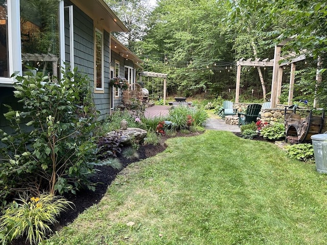 view of yard with a patio and a pergola