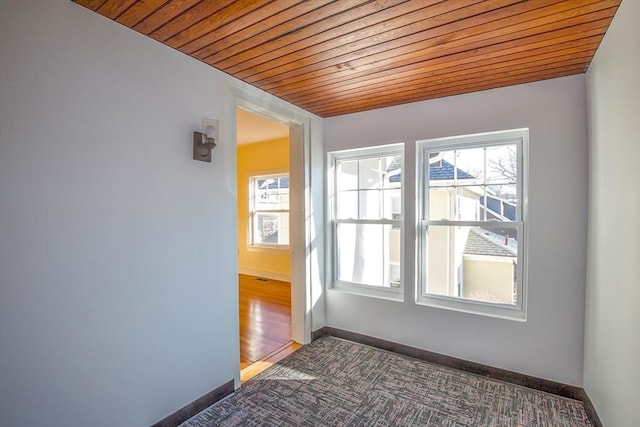 unfurnished room featuring wooden ceiling