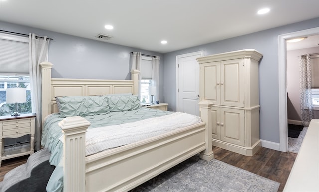 bedroom featuring dark hardwood / wood-style flooring