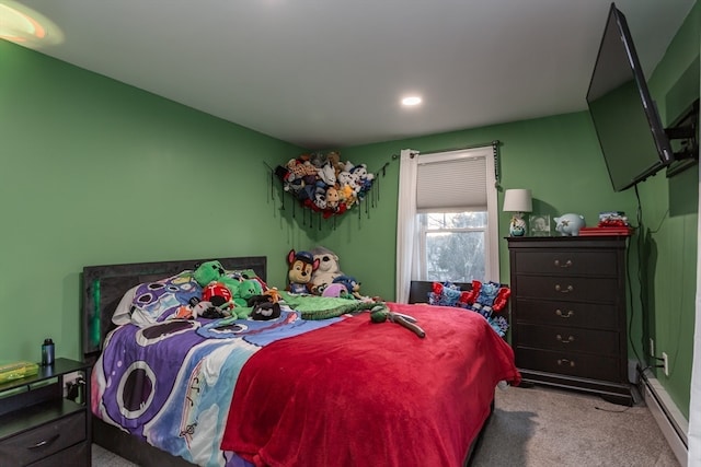 bedroom featuring light carpet and a baseboard heating unit