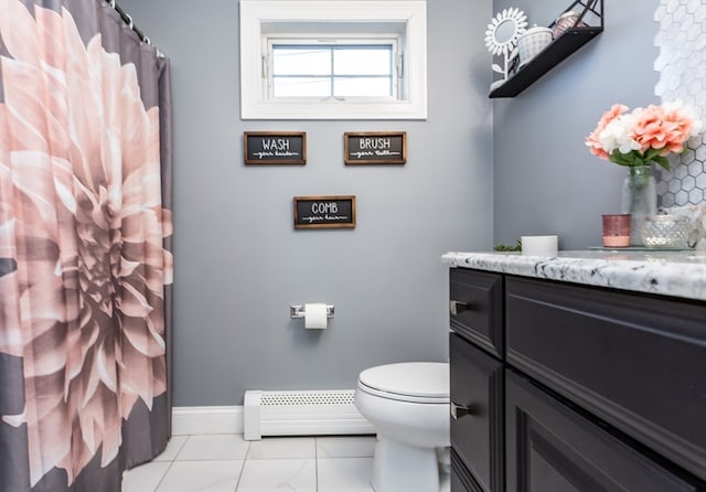 bathroom with vanity, toilet, and a baseboard radiator