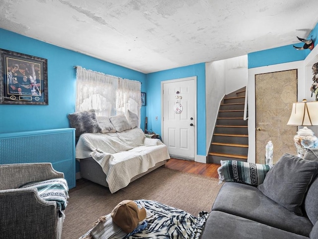 bedroom with dark hardwood / wood-style flooring