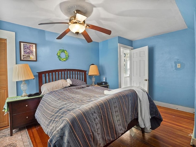 bedroom with hardwood / wood-style flooring and ceiling fan