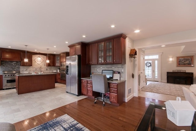 interior space featuring sink and light hardwood / wood-style flooring