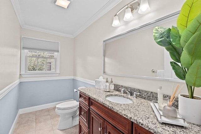 bathroom with vanity, tile patterned floors, ornamental molding, and toilet