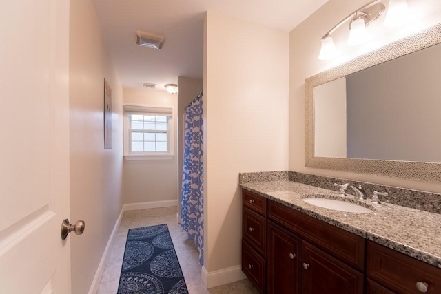 bathroom featuring vanity and tile patterned flooring