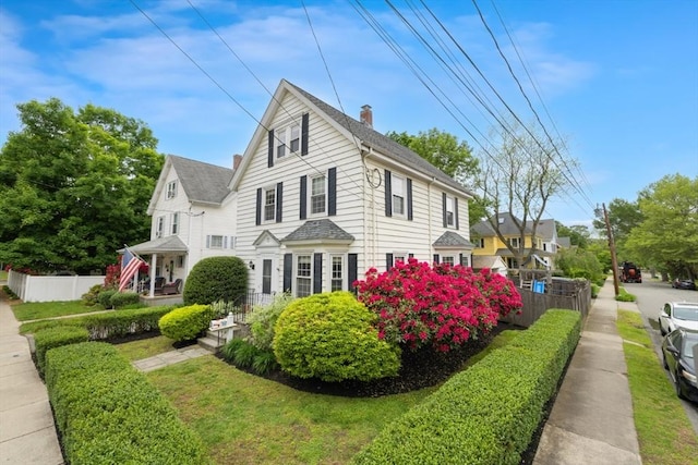 518 Washington St, Winchester, MA 01890 - view of side of property with a chimney and a shingled roof
