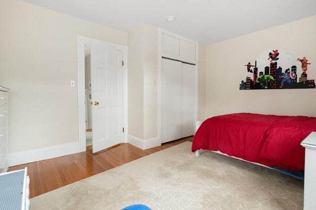 518 Washington St, Winchester, MA 01890 - bedroom with wood finished floors, baseboards, and a closet