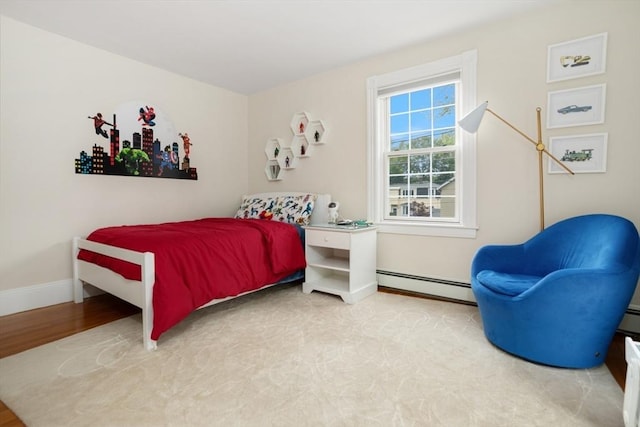 518 Washington St, Winchester, MA 01890 - bedroom with baseboard heating, baseboards, and wood finished floors