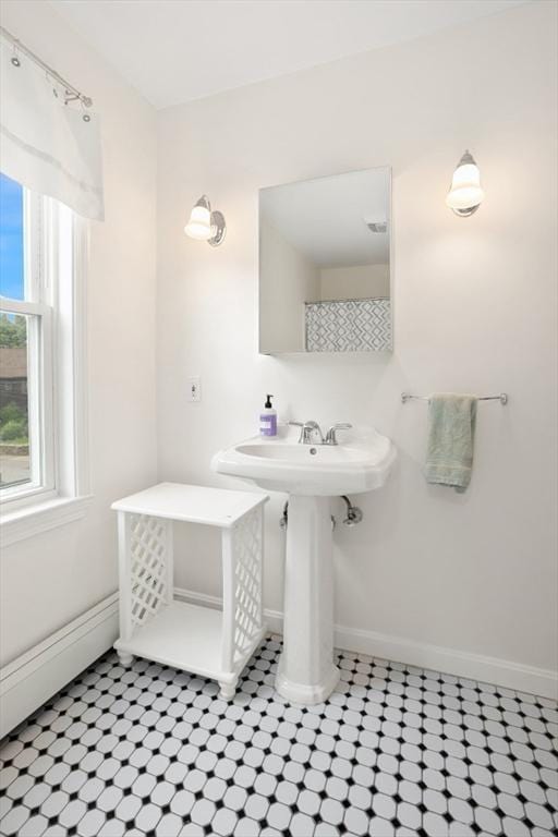 518 Washington St, Winchester, MA 01890 - bathroom featuring baseboards and a sink