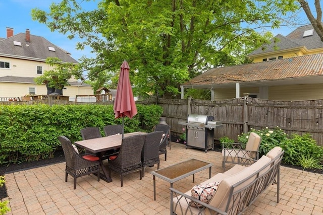 518 Washington St, Winchester, MA 01890 - fenced backyard with area for grilling, a patio area, and outdoor dining space
