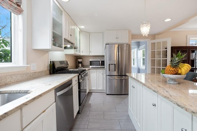 518 Washington St, Winchester, MA 01890 - kitchen featuring appliances with stainless steel finishes, under cabinet range hood, white cabinets, glass insert cabinets, and recessed lighting