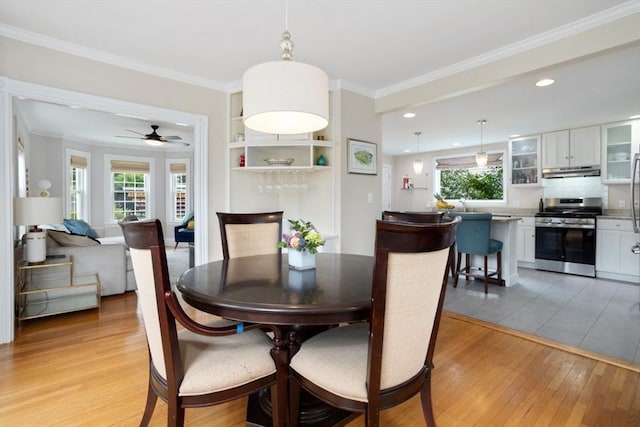 518 Washington St, Winchester, MA 01890 - dining room featuring light wood-type flooring, a ceiling fan, ornamental molding, and recessed lighting