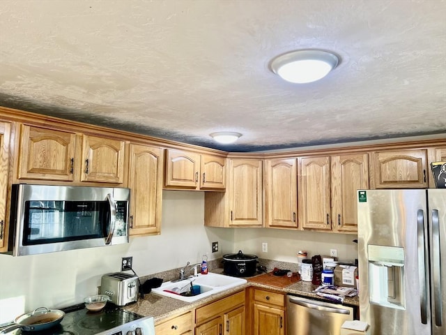 59 Sophia, Worcester, MA 01607 - kitchen with a sink, stainless steel appliances, and a textured ceiling