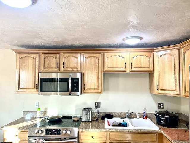 59 Sophia, Worcester, MA 01607 - kitchen with a textured ceiling, a sink, stainless steel appliances, and light countertops