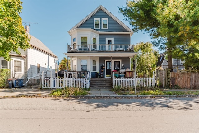 view of front of home featuring a balcony and covered porch