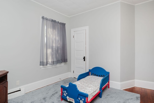 interior space with crown molding and hardwood / wood-style flooring