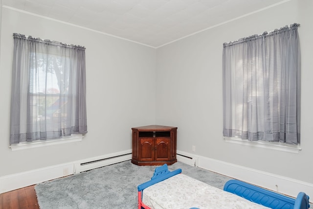 bedroom featuring crown molding and hardwood / wood-style floors