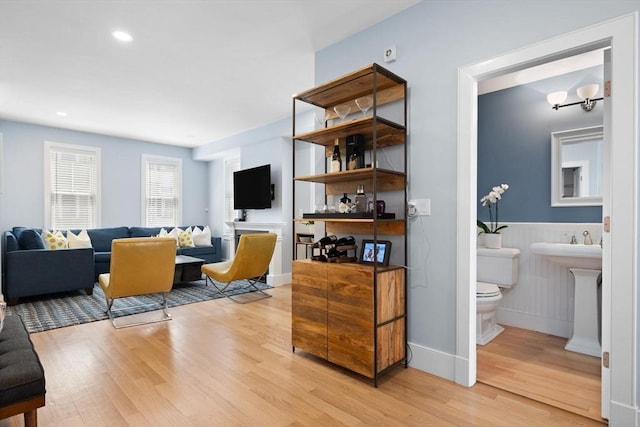 424-430 W 4th St Unit 428, Boston, MA 02127 - living room featuring light wood-style flooring, wainscoting, and recessed lighting