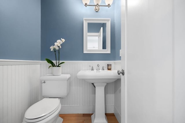 424-430 W 4th St Unit 428, Boston, MA 02127 - half bath with a wainscoted wall and wood finished floors