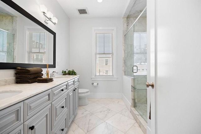 424-430 W 4th St Unit 428, Boston, MA 02127 - bathroom with marble look tiles, double vanity, and a stall shower