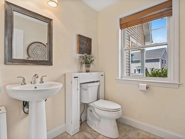 2 Carousel Ter, Dartmouth, MA 02747 - half bathroom with toilet, baseboards, and a sink