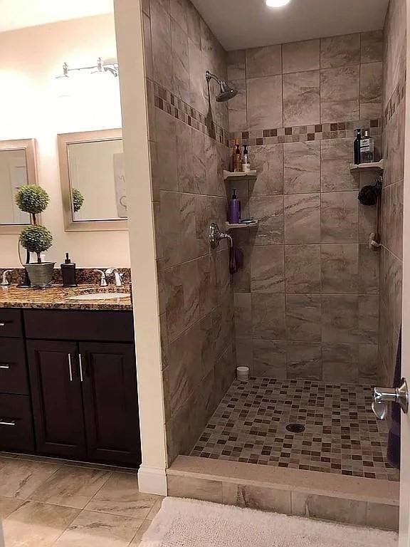 2 Carousel Ter, Dartmouth, MA 02747 - bathroom featuring a tile shower and vanity