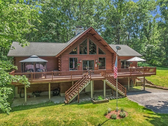 8 Turk Hollow Rd, Oxford, MA 01540 - back of property with a yard, a chimney, stairs, a gazebo, and log exterior
