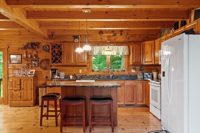 8 Turk Hollow Rd, Oxford, MA 01540 - kitchen with beamed ceiling, a sink, a center island, white appliances, and light wood-style floors